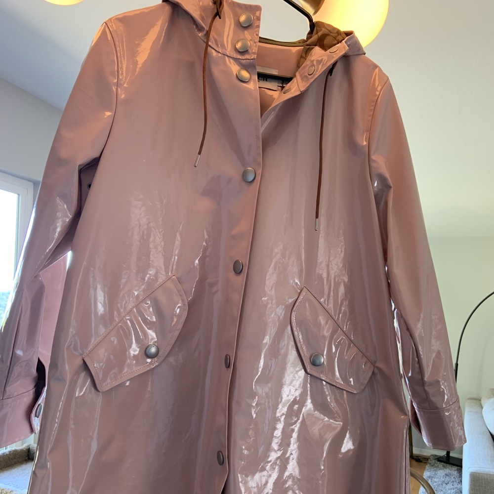 Brand New Coach Raincoat with signature lining.